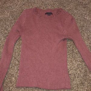 a pink long sleeved shirt